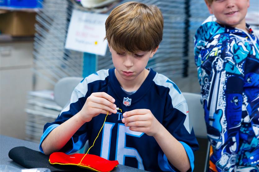 Fifth graders at Pearre Creek learn how to sew